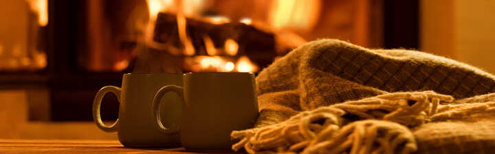 Hot drinks by a cosy fireplace
