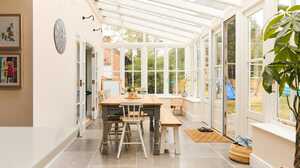A glazed garden room and dining space extension with a pitched glass roof, worked on by Maidenhead Planning.