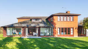 Rear elevation of a garden room extension seen from the garden