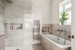 Niche shelving creates a stylish place to put your shampoo bottle