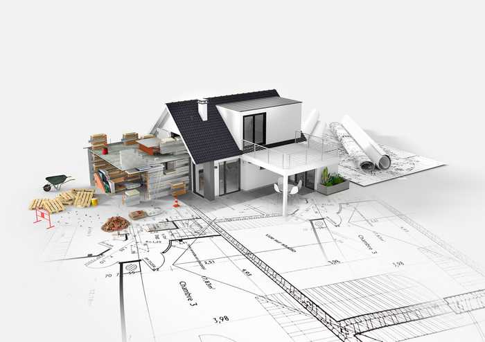 A picture of an architect's 3D model of a home extension, sat on top of architect's plans