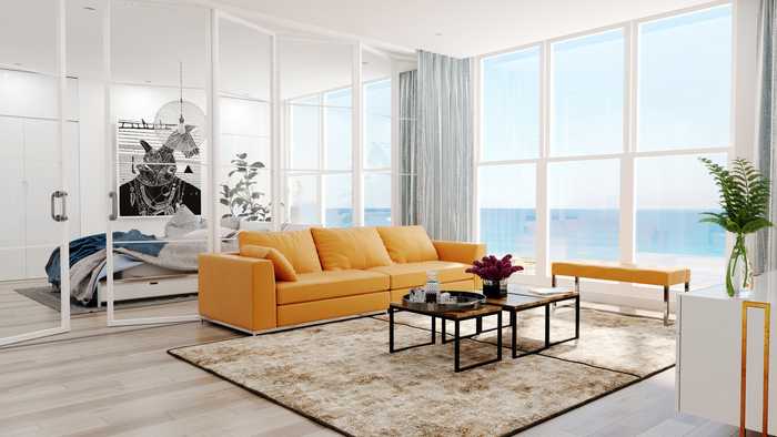 Large open plan modern living space with a sea view