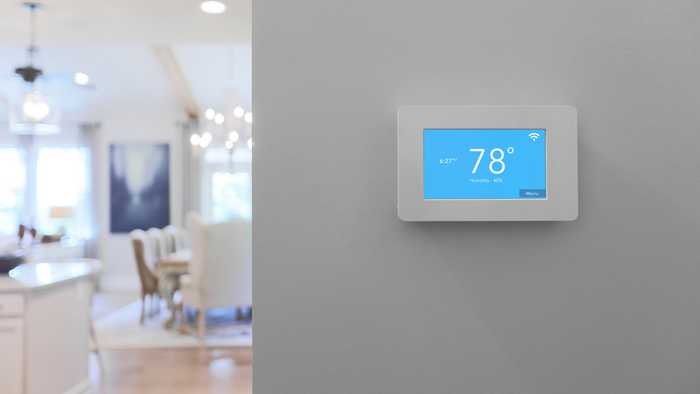 Smart thermostat mounted to the wall