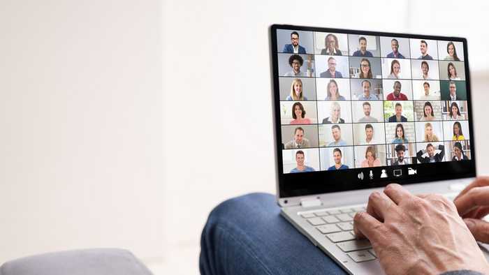 person working from home on a web conference on a laptop