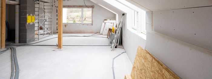 This is a picture of an extension in progress. With bare plaster boarded walls.