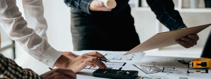 architectural plans with a calculator and architects 