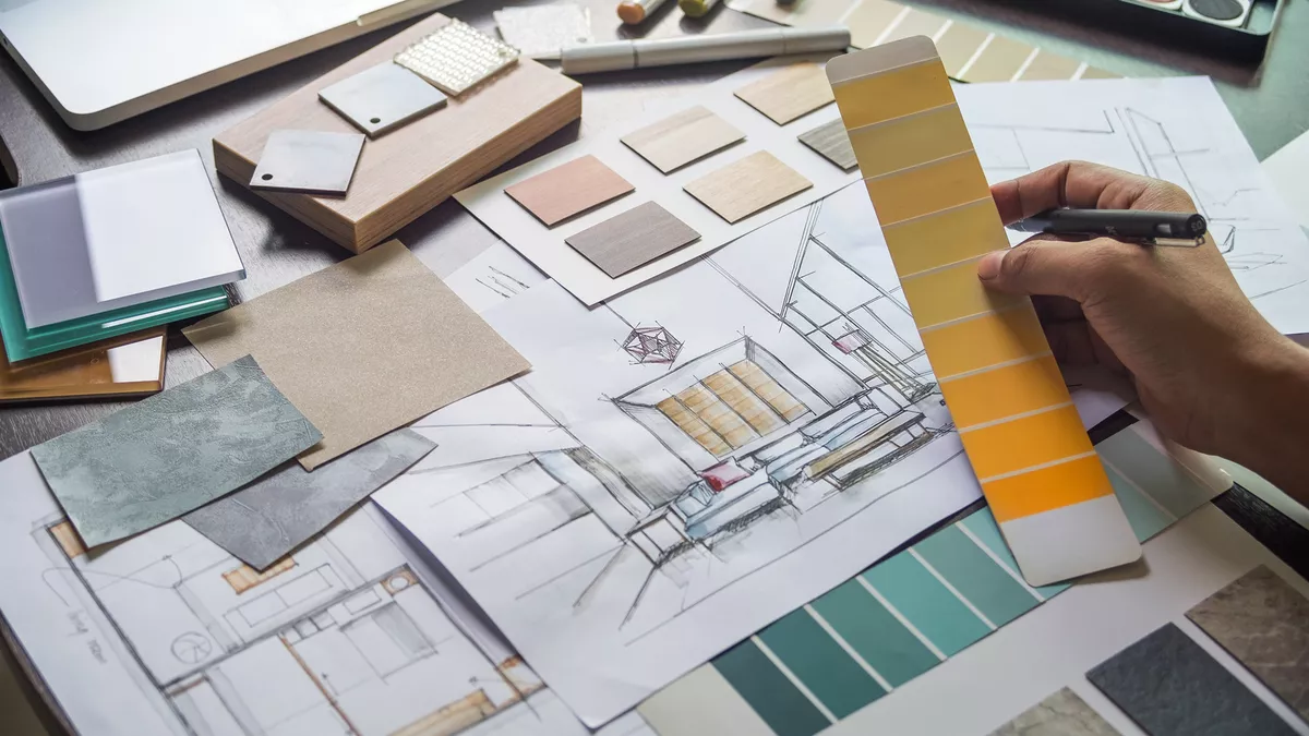 Hand-drawn interior sketch with timber, stone and paint samples during the concept design stage