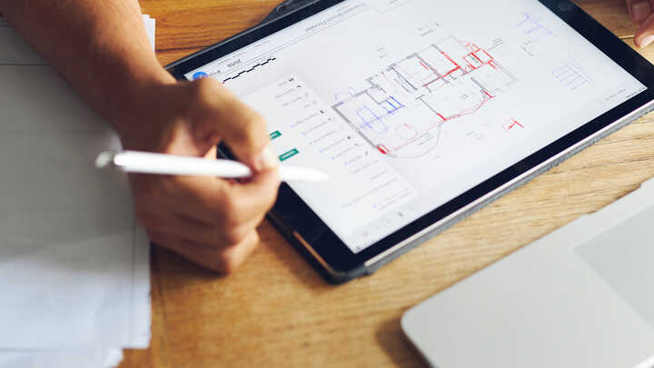 Wouter working on plans for a home extension