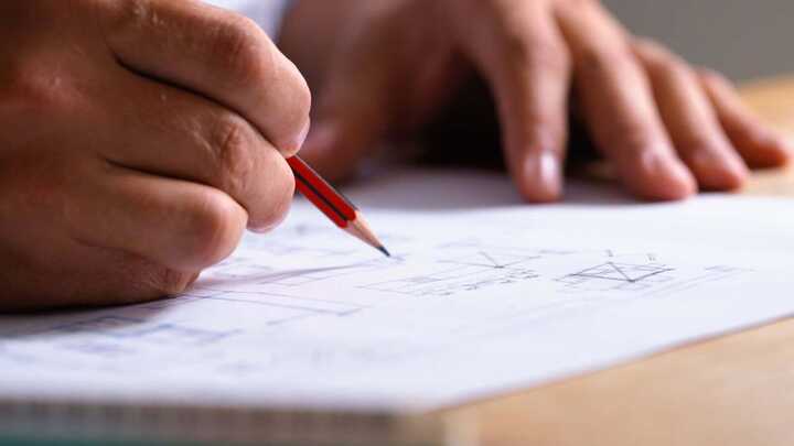 Wouter De Jager working on plans for a home extension